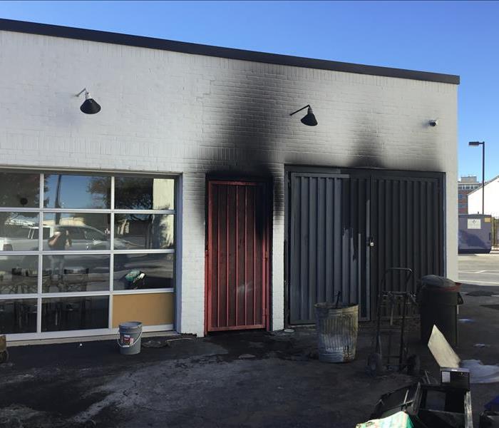 Side of a commercial restaurant with lots of soot