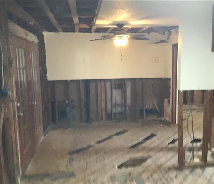 Kitchen after demo: removal of floor, ceiling and flood cuts to walls