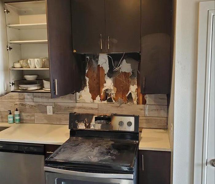 Kitchen stove charred after a fire