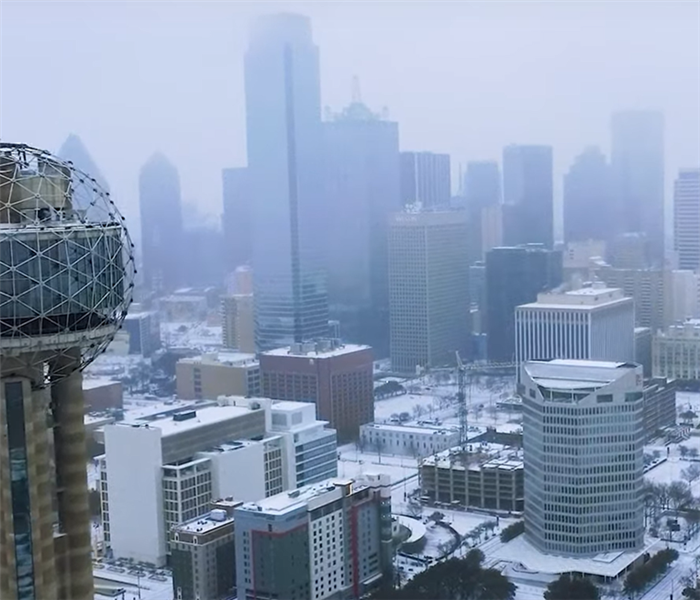 Snow covering streets & buildings in Downtown Dallas