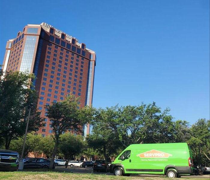 Green SERVPRO Van Parked In Front of Hilton Anatole